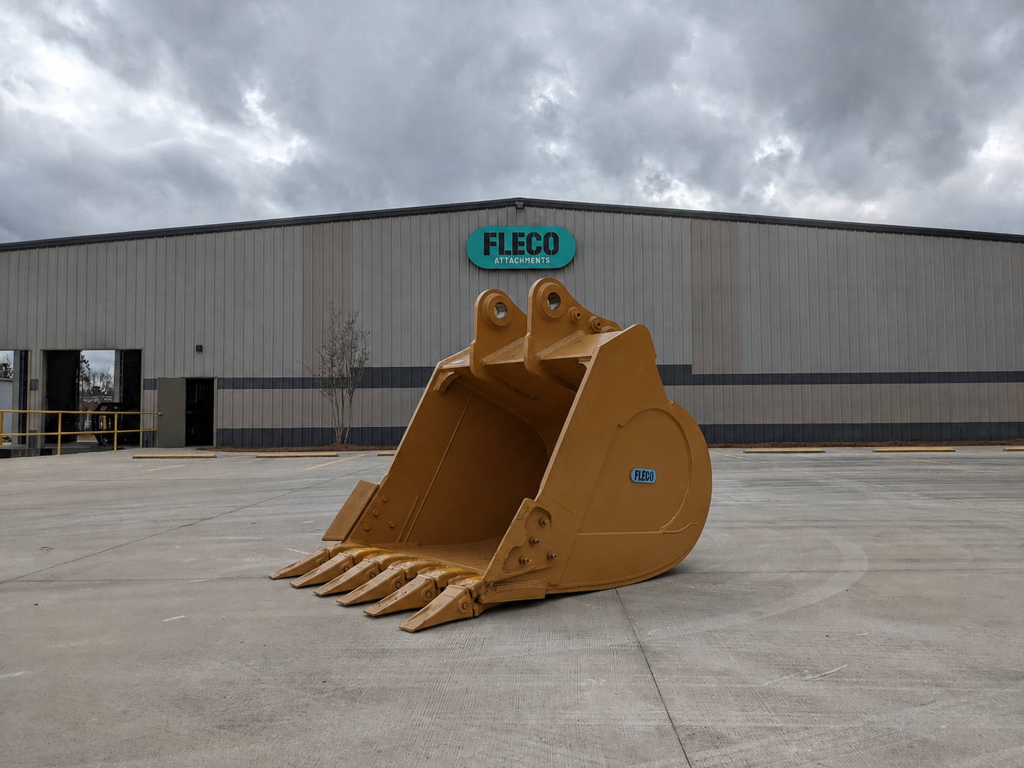 FLECO heavy-duty excavator bucket staged outside the warehouse